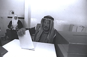 A Palestinian man places his vote into a ballot box during the 1996 elections, monitored by The Carter Center.