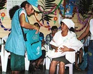 During an onchocerciasis training workshop, Maria and Martha Ramirez role-play for other health promoters.