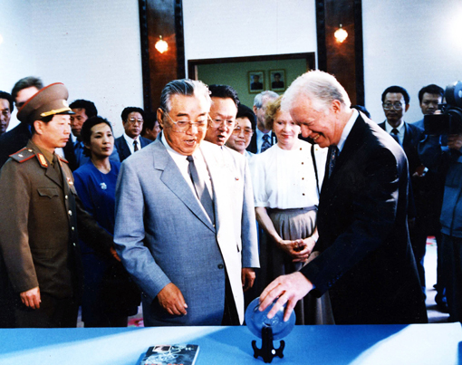 President and Mrs. Carter admire a gift presented by North Korea President Kim Il Sung.