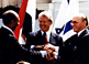 Egyptian President Anwar Sadat (left), U.S. President Jimmy Carter, and Israeli Prime Minister Menachem Begin make a three-way handshake at the signing of the Egyptian-Israeli Peace Treaty.