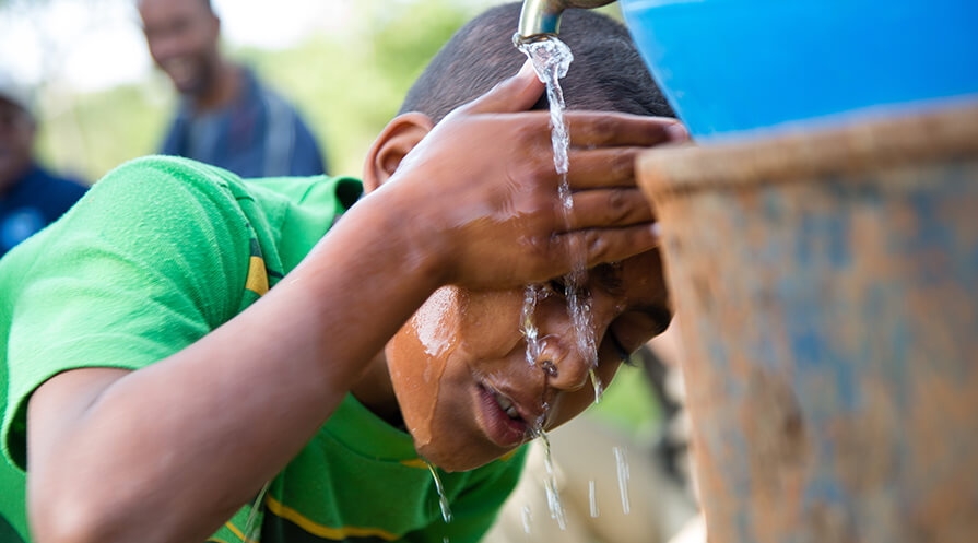 In the Amhara region of Ethiopia, a boy washes his face to prevent trachoma infection.