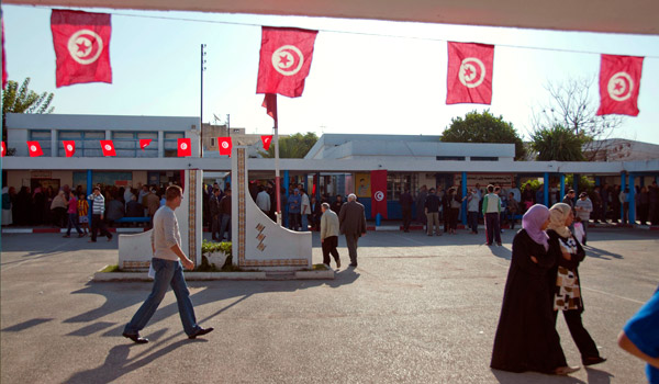 The Tunisian flag could be seen in many places, strung across polling centers; hung from light posts; and draped on people, buildings, and cars.