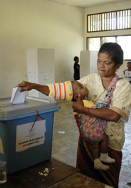 A woman votes in East Timor's parliamentary elections on June 30.