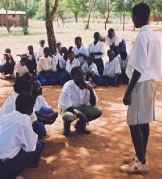 Tanzanian students learn about latrine use.