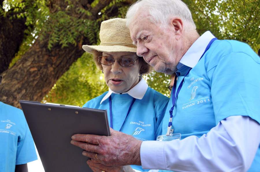 President and Mrs. Carter complete their observer checklist at a polling station on Jan. 9 in Juba.