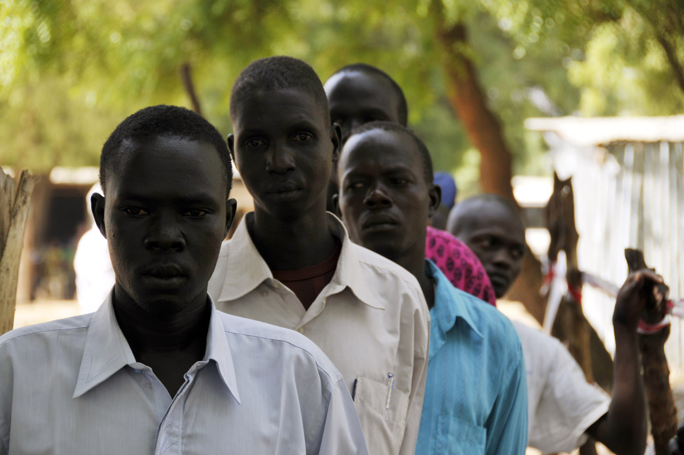 Men wait in line to vote in Sudan referendum. (Men and women vote separately.)