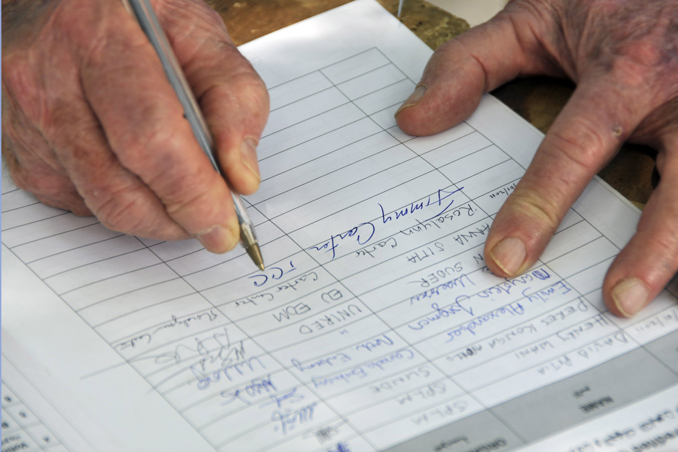 Jimmy Carter signs polling journal outside Juba.