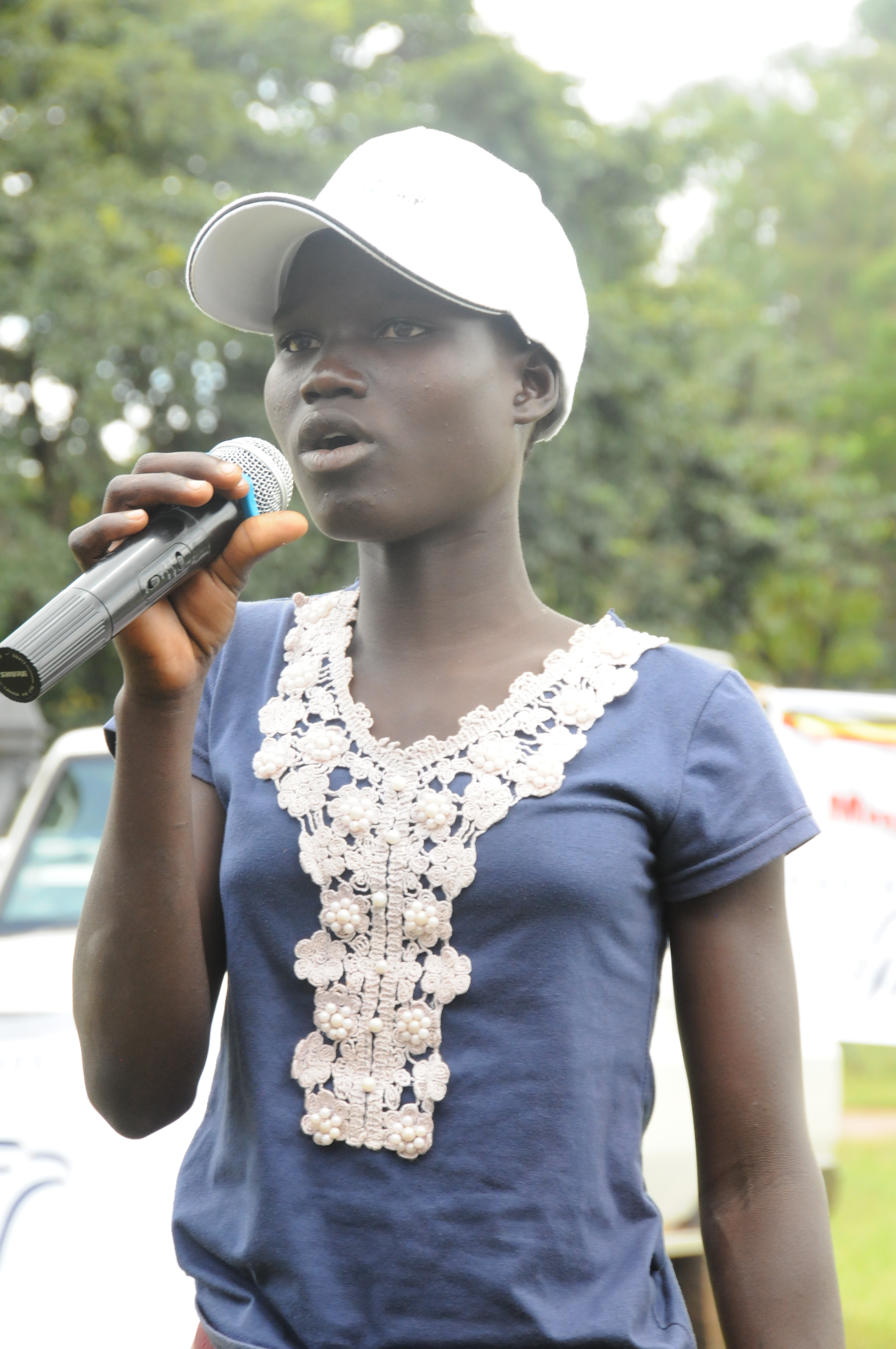 Nancy Akanyo, 14, speaks to the crowd after receiving the 200 million and first treatment of Mectizan to prevent river blindness.