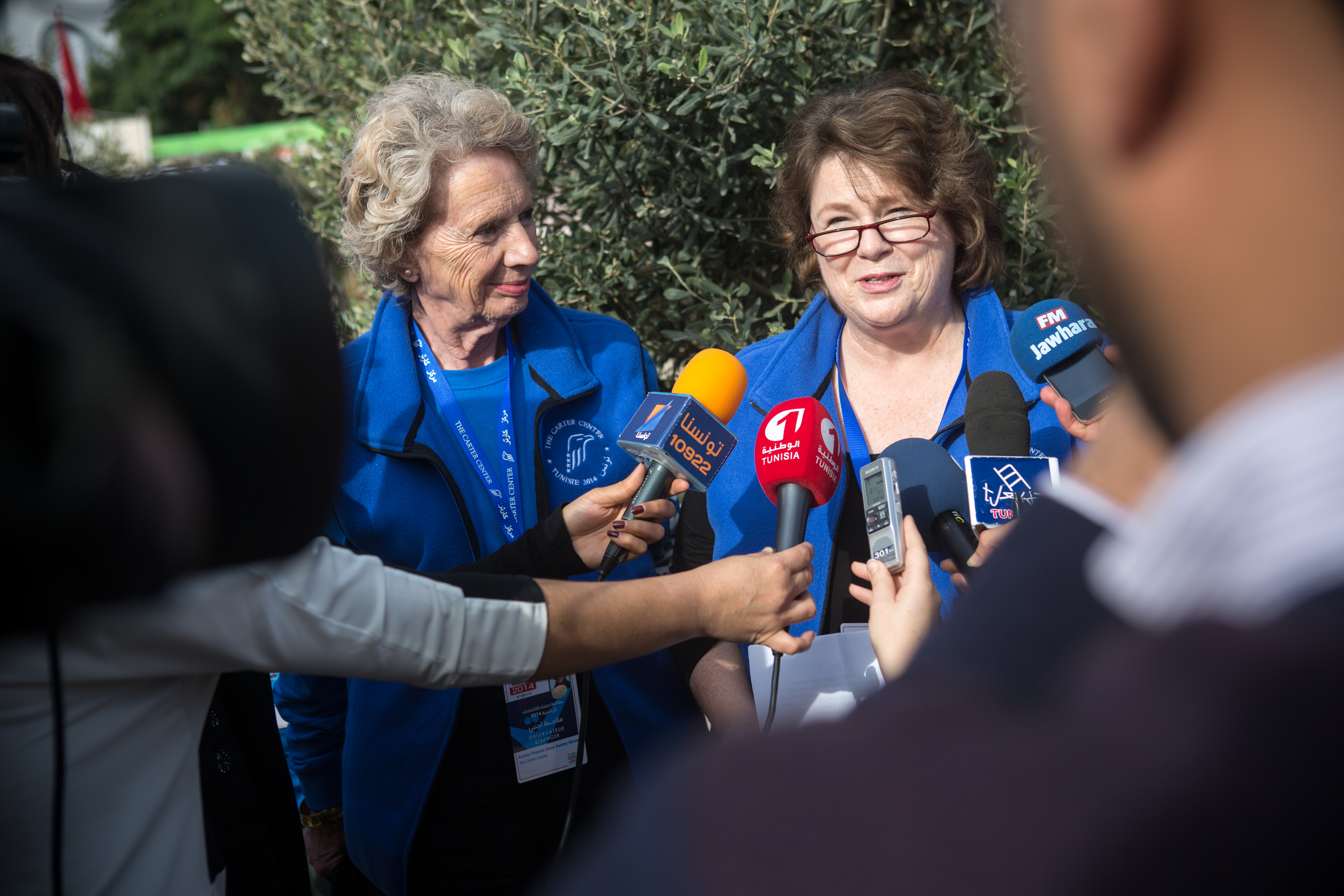 Ambassador (Ret.) Mary Ann Peters, Carter Center CEO, briefs Tunisian and international media about the Center's observation delegation at a polling center in Tunis early on election day. Next to her is co-leader Amb. Audrey Glover of the United Kingdom. The Center deployed about 80 international observers to all 27 constituencies in Tunis.