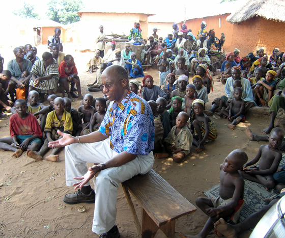 The Carter Center's Dr. Donald Hopkins speaks to a Nigerian village about Guinea worm disease prevention. 
