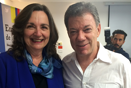 Jennie with Santos: Jennie Lincoln poses with Colombia President Juan Manuel Santos during a break in April’s meeting to discuss necessary reforms in the wake of a potential peace accord. 