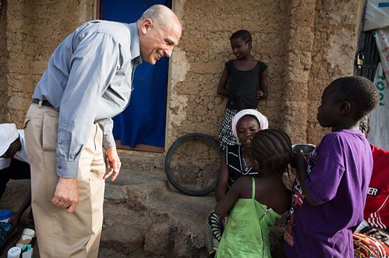 Dr. Dean Sienko, the Carter Center’s vice president for health programs, chats with children during a November 2016 visit to Dogon Daji Village, Bassa Local Government Area, Plateau State, Nigeria.