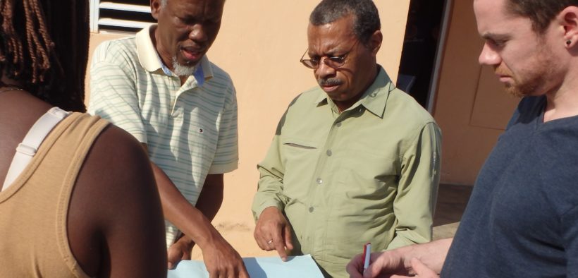 Dr. Stephen Blount, second from right, works with Carter Center consultants.