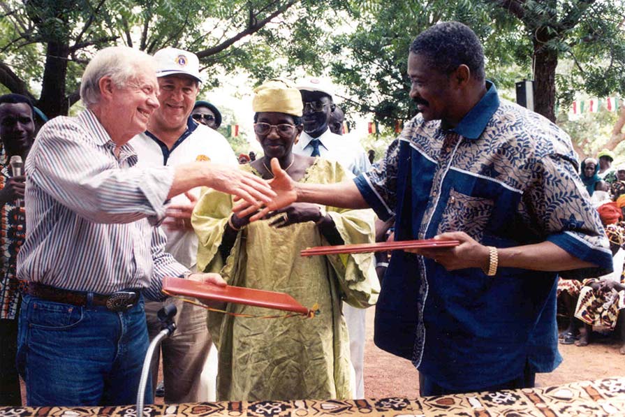 Carter and Toure shake hands