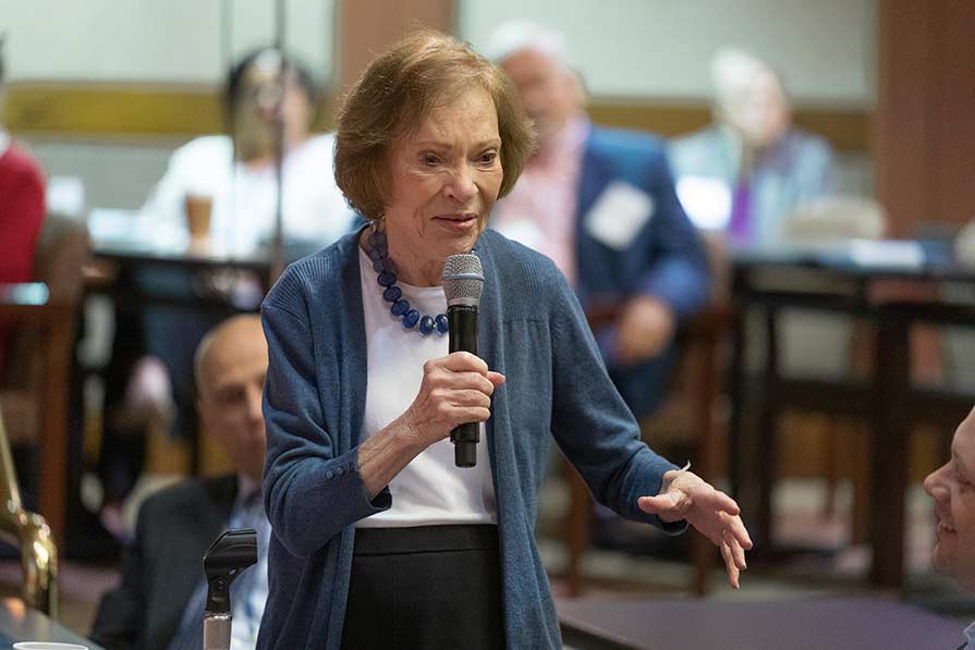 Rosalynn Carter with mic in hand.