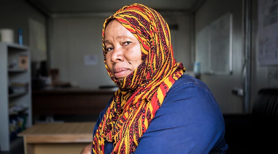 Safi Inorano is also a cleaner with two daughters living and going to school far away. Since the civil war, she can no longer dress how she likes in town, so she dresses conservatively and then changes into something more her style when she gets to work.
