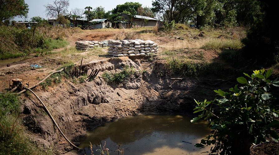 A muddy pit of water at the Seife commercial farm in Ethiopia’s Gambella region