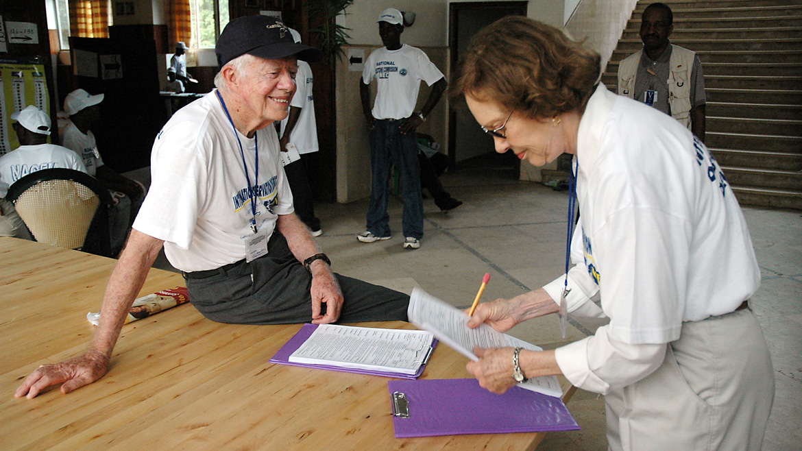 In the last 35 years, Rosalynn and Jimmy Carter have observed dozens of elections, helping to advance democracy worldwide. Here they prepare for poll closing procedures during elections in Monrovia, Liberia, on October 11, 2005. (Photo: The Carter Center)