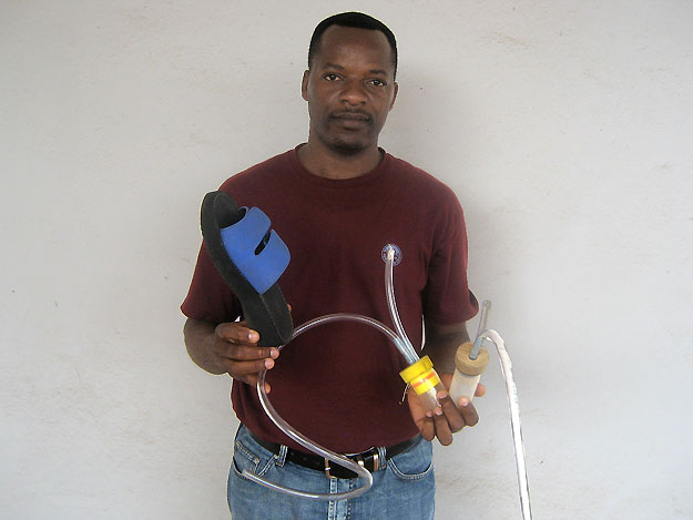 Philippe Nwane displays his home-made aspirator.