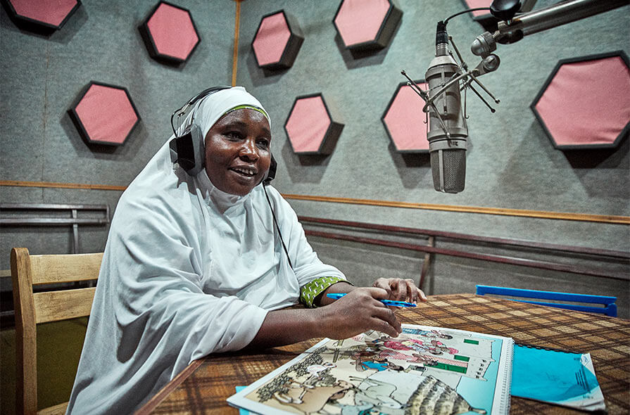 Rakia Adamou gives listeners a trachoma prevention message during a live broadcast at ORTN, Zinder Regional Radio Station in Niger.