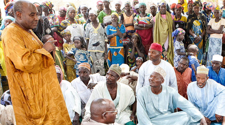 Mohamed Salissou Kané speaks to a community in the Matameye district of Zinder region, Niger, about how to prevent trachoma, the world's leading cause of preventable blindness. (Photo: The Carter Center/ A. Mosher)