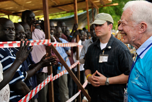 Former U.S. President Jimmy Carter talks to voters in Juba, Southern Sudan, on Jan. 9, 2011, in a historic referendum on secession observed by The Carter Center. Several million Southern Sudanese voted nearly unanimously for separation from Sudan, resulting in the formation of South Sudan as an independent nation. The Carter Center observed the entirety of the referendum process, beginning in August 2010 and continuing through the conclusion of polling, counting, and tabulation of votes.