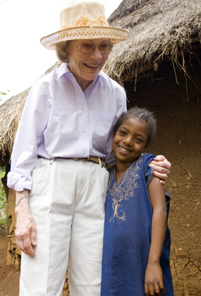 Former First Lady Rosalynn Carter hugs the youngest daughter of the Hlmenlike family.