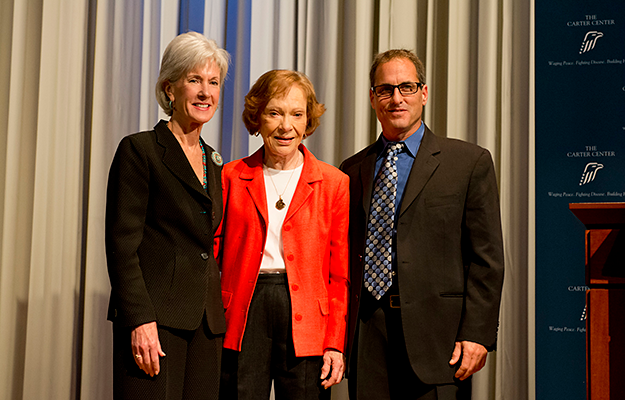 On Nov. 8, 2013, Health and Human Services Secretary Kathleen Sebelius (left), former First Lady Rosalynn Carter (center), and David Wellstone (right), son of the late Senator Paul Wellstone, celebrated the release of final regulations on mental health parity during the 29th Annual Rosalynn Carter Symposium on Mental Health Policy held at The Carter Center in Atlanta.
