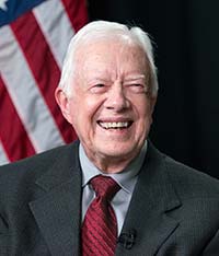 Jimmy Carter portrait with an American flag in the background.