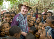 Photo of children greeting Dr. Paul Emerson