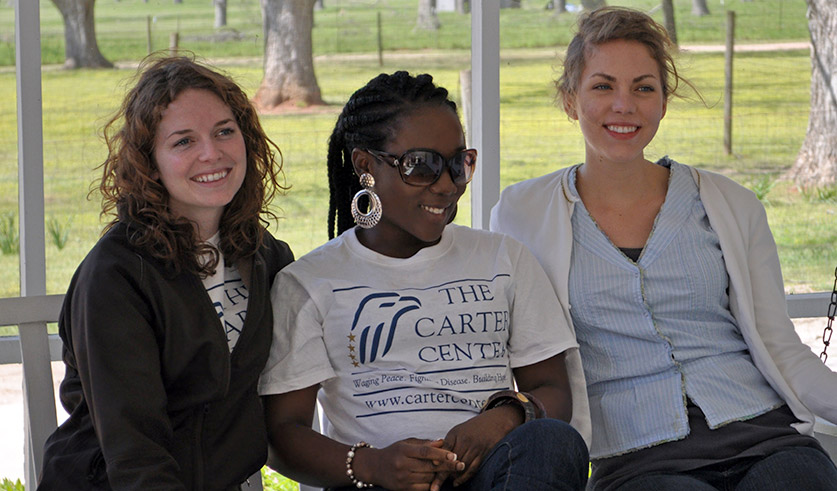 Photo of three interns at President Carter's boyhood home in Plains, Ga.